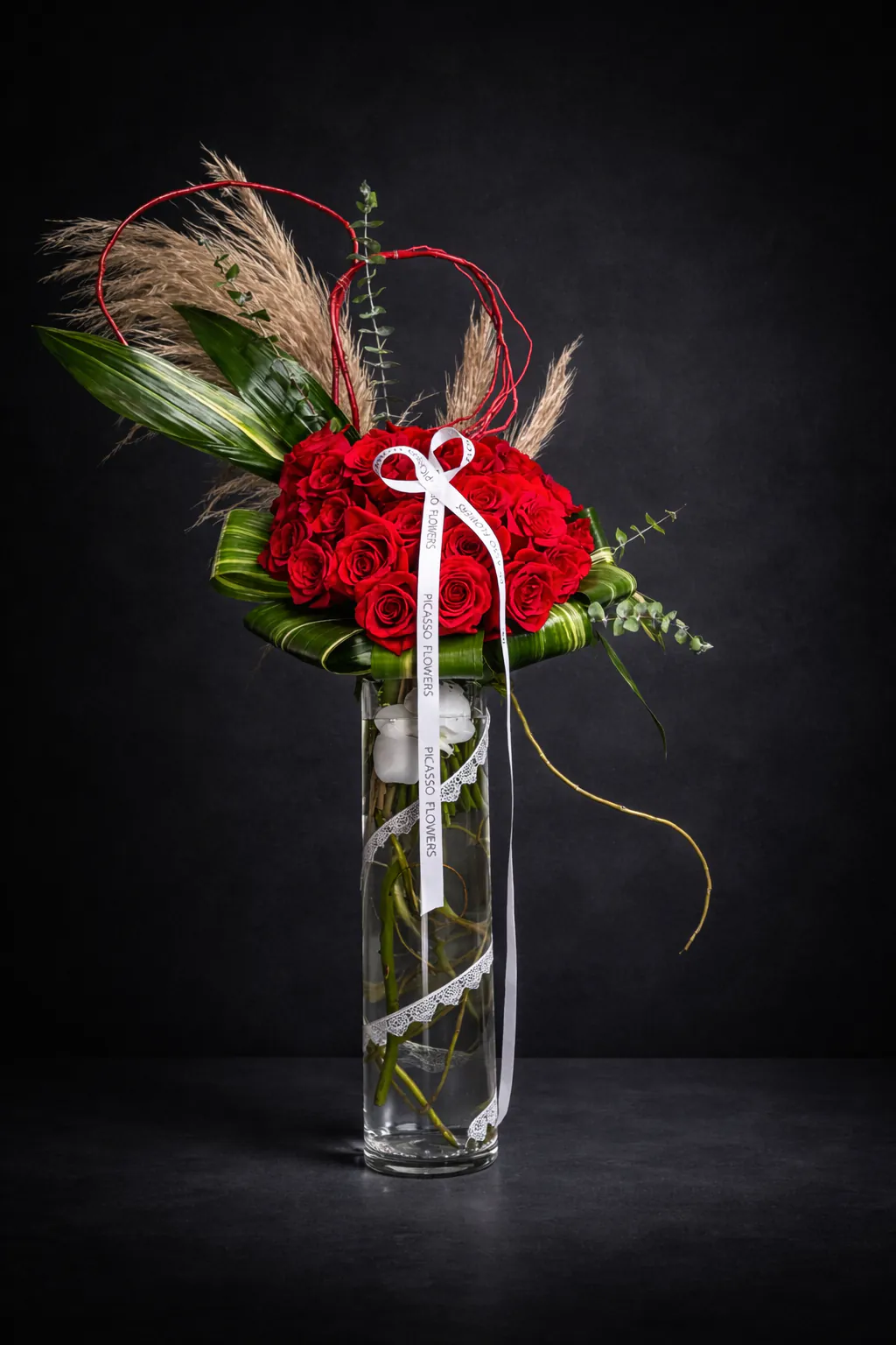 Holiday flowers by Naples Picasso Flowers — festive red arrangement by a Master Designer in Naples, FL