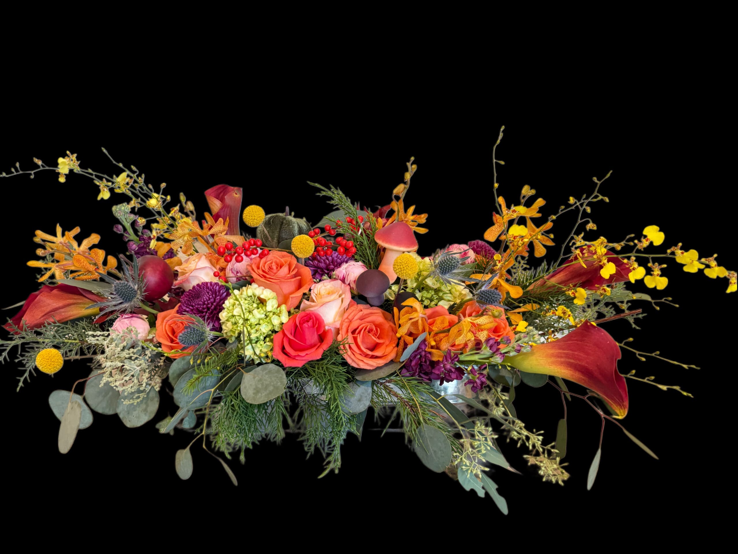 Low autumn centerpiece in coral and amber with woodland accents, fall table flowers by Naples Picasso Flowers, Naples FL